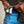 Load image into Gallery viewer, Person adjusting a green belt with a white label on a beige background