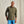Load image into Gallery viewer, Man wearing an olive green shirt and blue jeans against a beige background