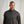 Load image into Gallery viewer, Man wearing a gray pullover with a blue zipper against a plain background