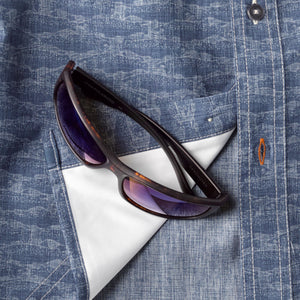 Polarised sunglasses layed on shirt