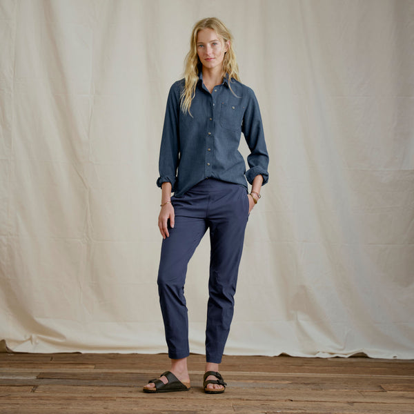 woman modelling dark blue shirt and blue pants