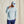 Load image into Gallery viewer, Man wearing a light gray long-sleeve shirt and blue pants against a beige background