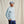 Load image into Gallery viewer, Man wearing a light blue long-sleeve shirt and dark blue pants against a beige background