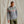 Load image into Gallery viewer, Guy modeling dark green shorts and grey hoodie from Orvis