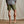 Load image into Gallery viewer, man wearing dark green shorts and flip flops