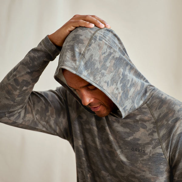 Person wearing a camouflage hoodie with 'ORVIS' branding.