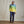 Load image into Gallery viewer, man wearing dark blue pants and yellow,green and blue half zipped sweatshirt