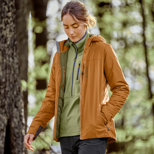 woman in the woods wearing Orvis outfit