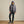 Load image into Gallery viewer, woman wearing dark grey pants, wading boots and jacket and dark blue cap