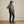 Load image into Gallery viewer, woman wearing dark blue cap, dark grey waterproof jacket and dark grey pants
