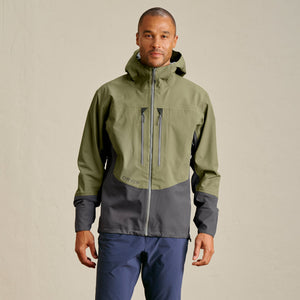 man wearing green and grey waterproof jacket