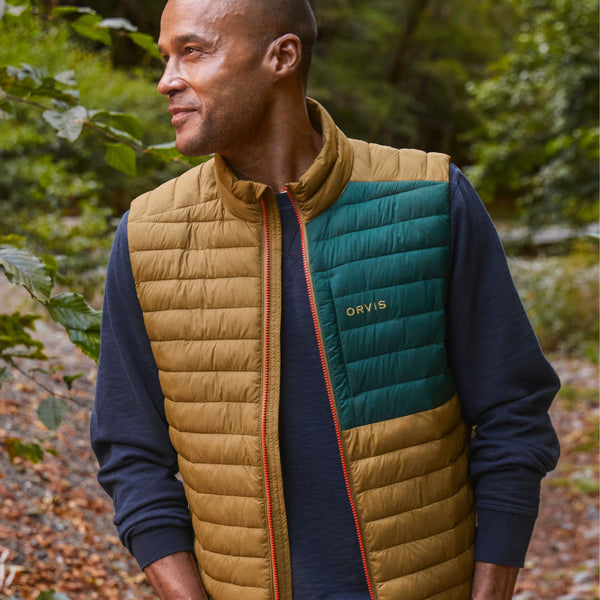 man in the forrest wearinggreen and yellow gilet for men