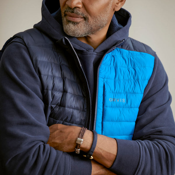 closeup of man wearing blue gilet for men