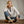 Load image into Gallery viewer, woman seated on wooden floor