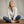 Load image into Gallery viewer, woman sat on wooden floor smiling