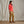 Load image into Gallery viewer, woman modelling red sweater and beige pants