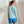 Load image into Gallery viewer, woman with her back to the camera wearing light blue hoodie and blue shorts