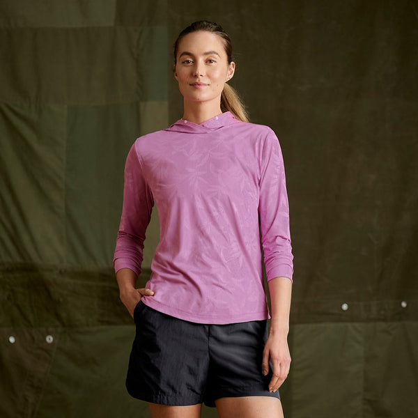 woman wearing pink hoodie and black shorts