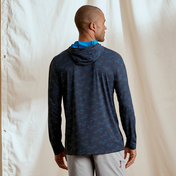 man with his back to the camera wearing dark blue hoodie