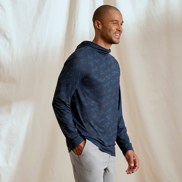 man smiling in dark blue hoodie