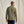 Load image into Gallery viewer, Man wearing a green long-sleeve shirt against a beige background