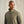 Load image into Gallery viewer, Man wearing a green pullover against a beige background