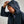 Load image into Gallery viewer, Man wearing a dark jacket with a hood against a plain background