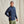 Load image into Gallery viewer, Man wearing a navy blue jacket against a beige background