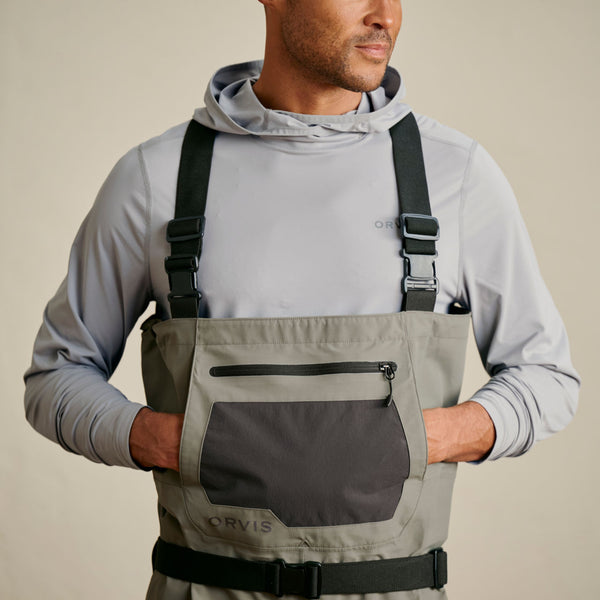 cloesup of man wearing grey hoodie and waders