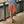 Load image into Gallery viewer, man wearing orange shorts and beige sneakers