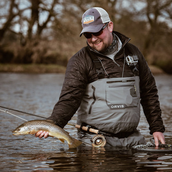 man showing fish to the camera