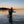 Load image into Gallery viewer, man wading in river at sunset