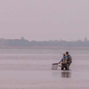 two people wading