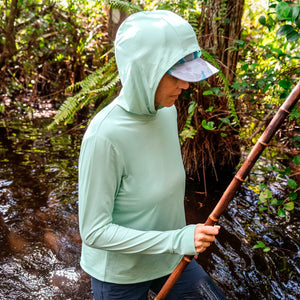 woman wearing light green hoodie