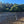 Load image into Gallery viewer, man fly fishing on river bank