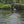 Load image into Gallery viewer, man wading with fishing net in river