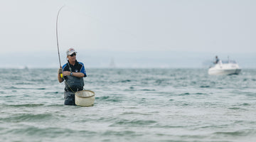Man fishing in the sea at Orvis Saltwater Fly Fishing Festival