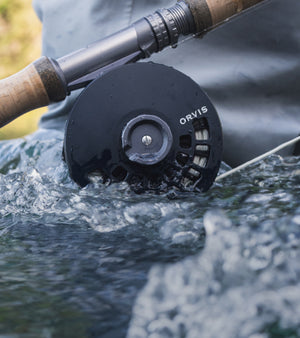 closeup of Orvis fly reel in action