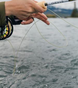 closeup of fly rod and reel in use