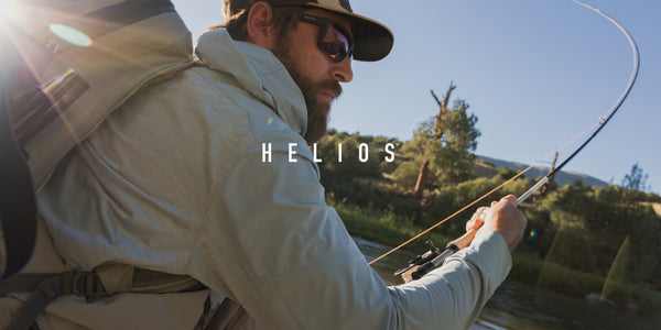 Promo image of man fly fishing in river with helios fly rod