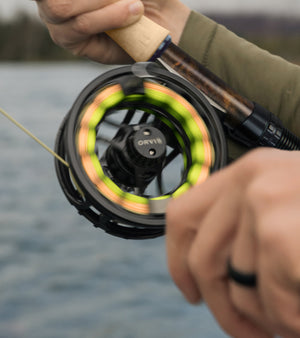 closeup of fly reel spinning/being in use