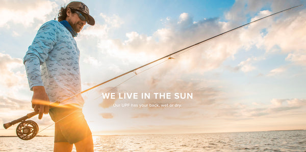 Upf fishing clothes marketing image of man fly fishing