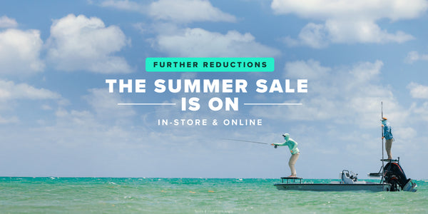 man fly fishing from boat ith summer sale text on top
