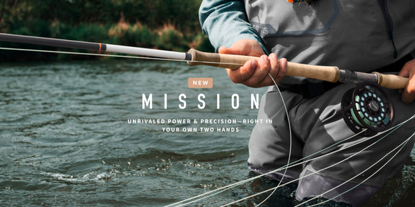 Person holding a fishing rod with water in the background, featuring the Mission brand.