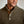 Load image into Gallery viewer, Close-up of a man wearing a brown ribbed sweater with buttons.
