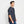 Load image into Gallery viewer, man wearing dark blue polo shirt from Orvis
