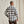 Load image into Gallery viewer, Man wearing a black and white checkered shirt against a beige background
