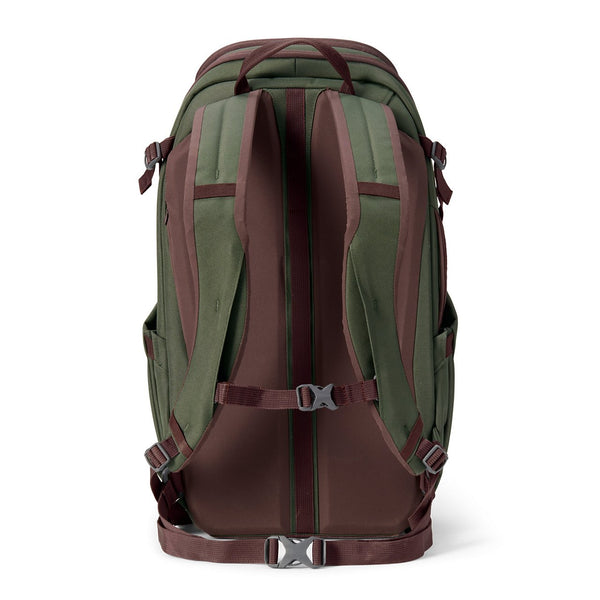 green and brown backpack on white background