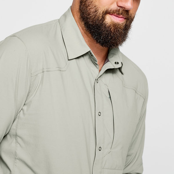closeup of man wearing green shirt