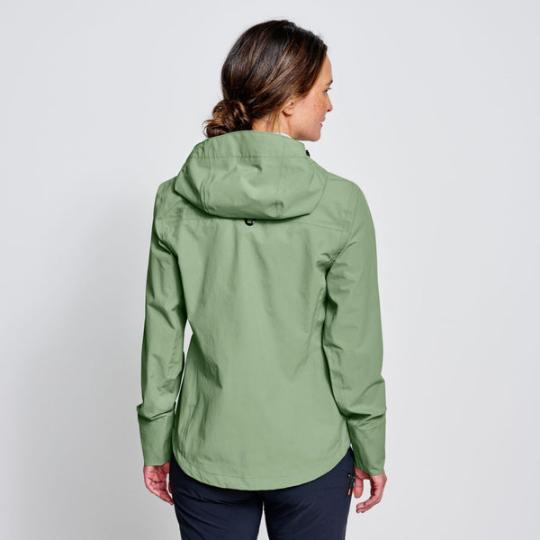 woman with back to the camera wearing lime green jacket